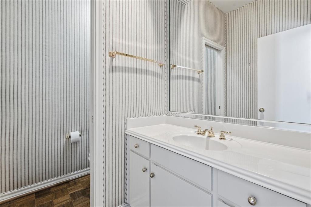 22 1 Main Place Benbrook, TX 76126 - Photo 7 of 40 a bathroom with a sink and a mirror