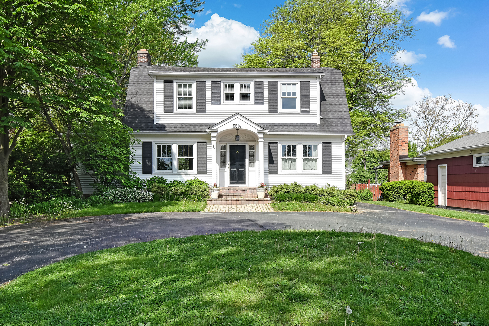 5514 South County Line Road Hinsdale, IL 60521 - Photo 1 of 1 a front view of a house with yard and green space