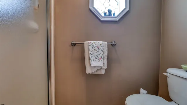 a bathroom with a toilet and a sink