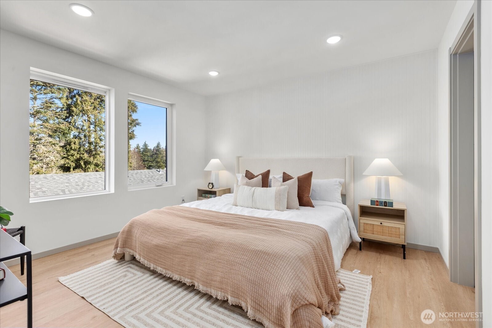 4104 49th Avenue Southwest, Unit B Seattle, WA 98116 - Photo 11 of 17 a bedroom with a bed and a window