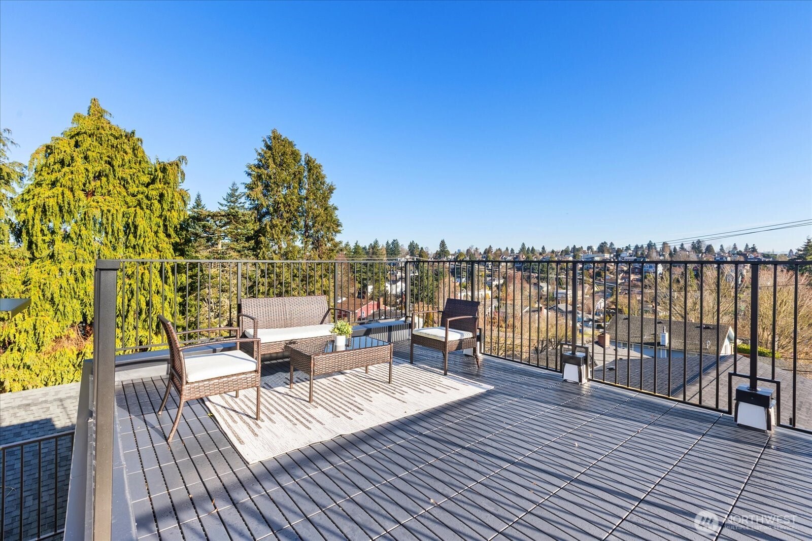 4104 49th Avenue Southwest, Unit B Seattle, WA 98116 - Photo 15 of 17 a view of a balcony with wooden floor and seating space