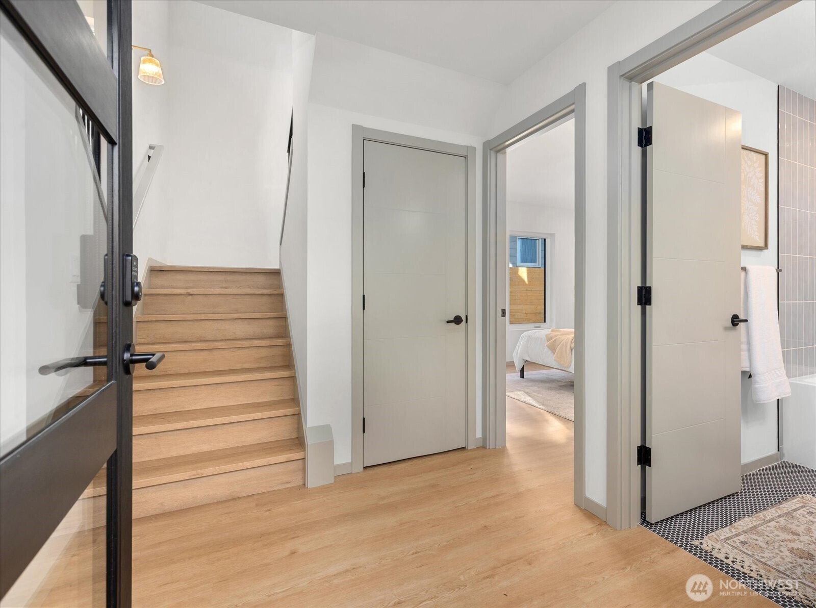 4104 49th Avenue Southwest, Unit B Seattle, WA 98116 - Photo 3 of 17 a view of a hallway with wooden floor and entryway