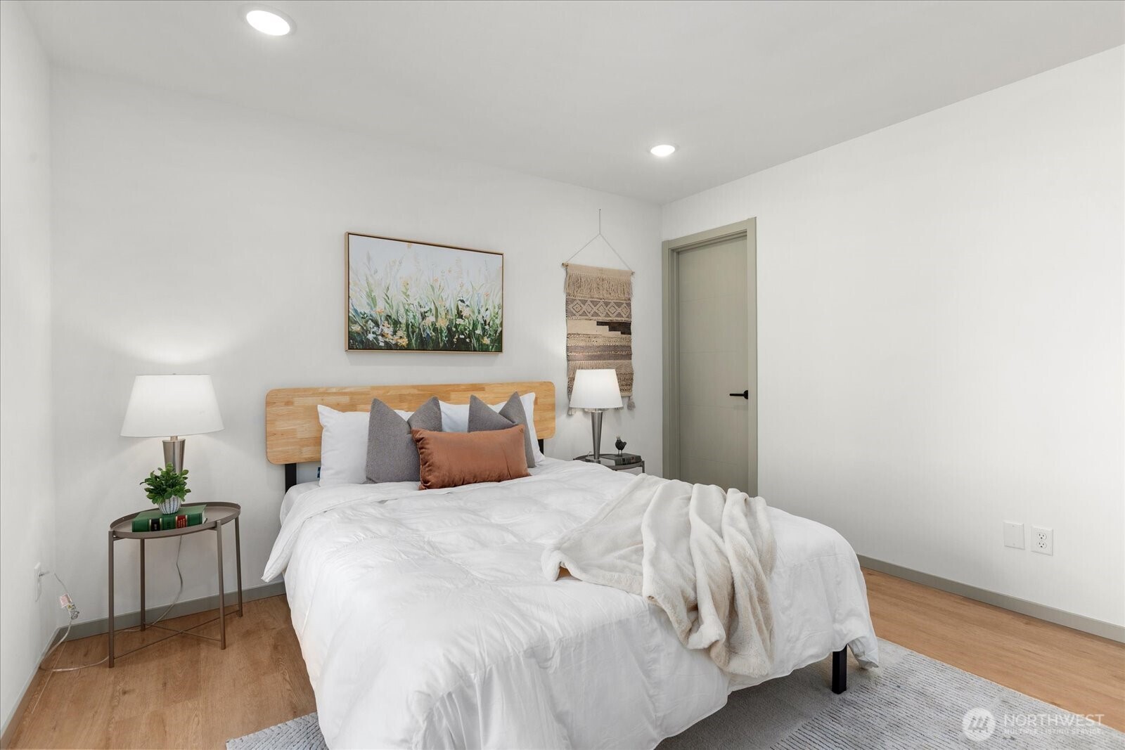 4104 49th Avenue Southwest, Unit B Seattle, WA 98116 - Photo 5 of 17 a bedroom with a bed and a painting on the wall