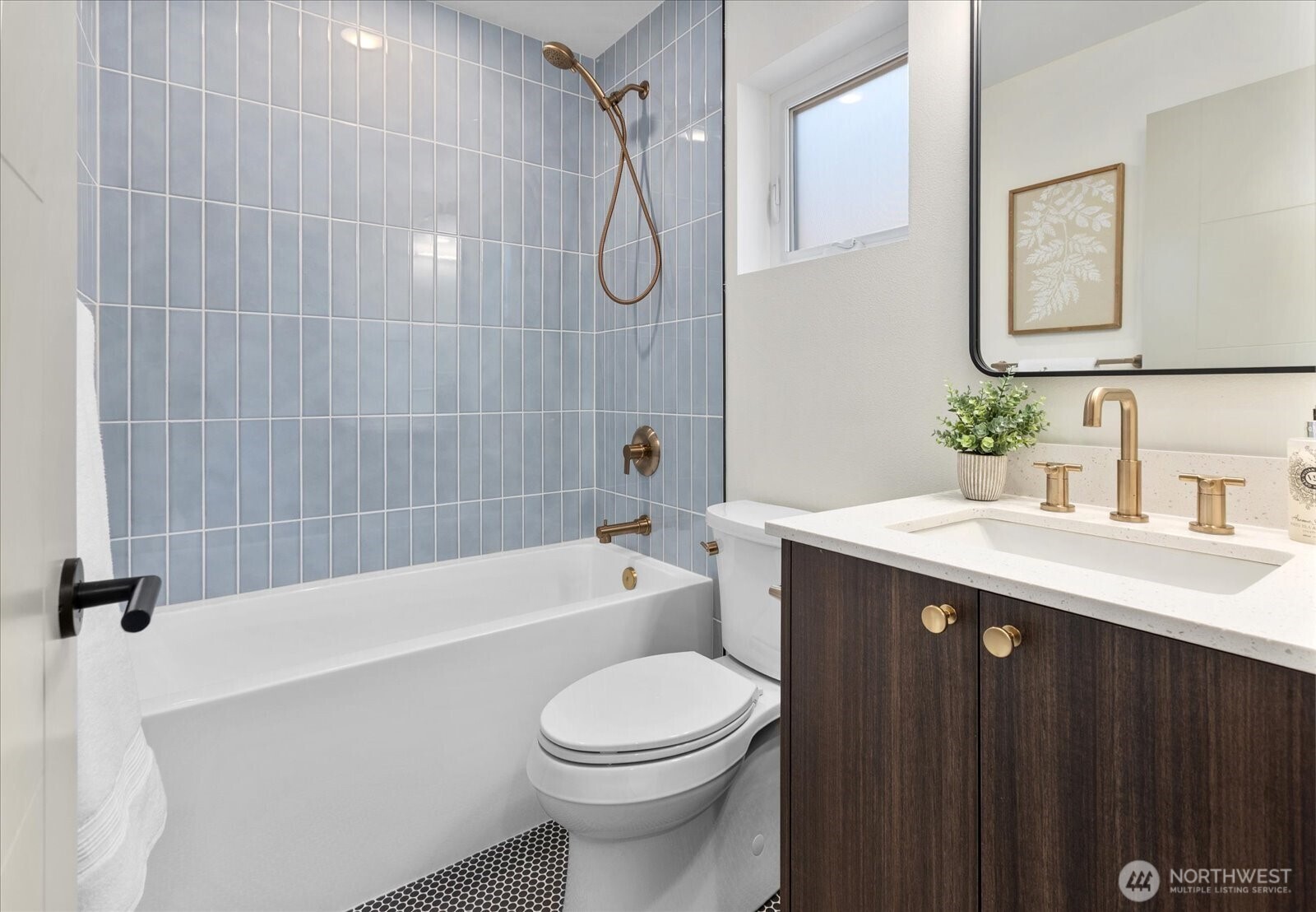 4104 49th Avenue Southwest, Unit B Seattle, WA 98116 - Photo 6 of 17 a bathroom with a sink a toilet and shower