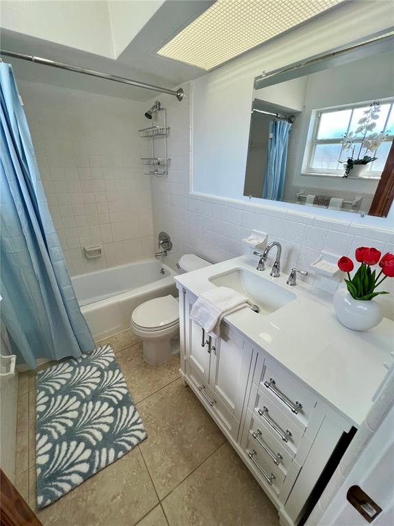 11315 3rd Street East Treasure Island, FL 33706 - Photo 13 of 46 a spacious bathroom with a sink a toilet and shower