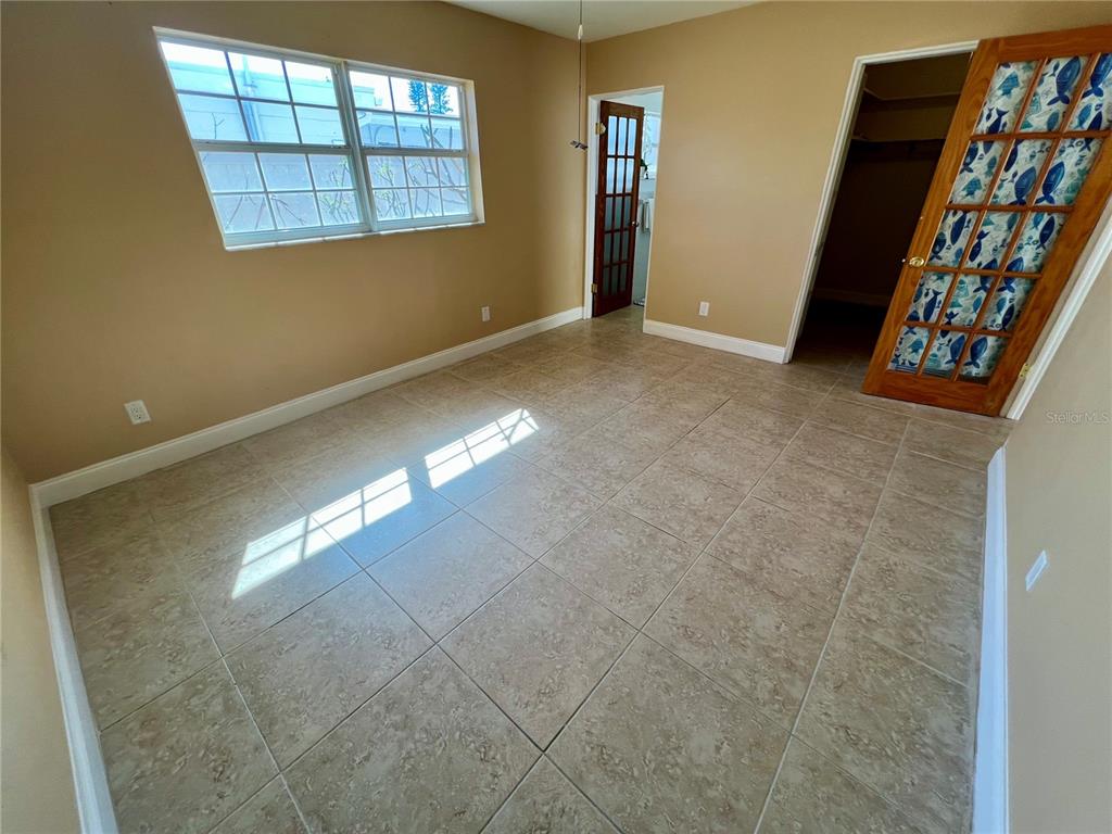 11315 3rd Street East Treasure Island, FL 33706 - Photo 15 of 46 an empty room with windows and closet