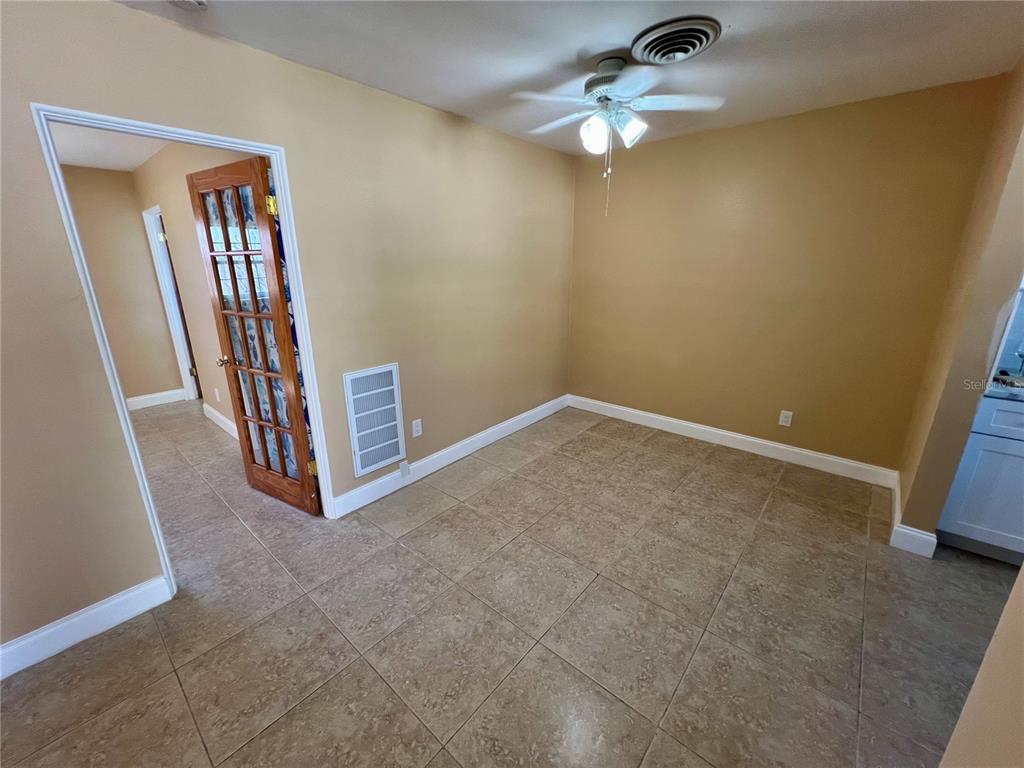 11315 3rd Street East Treasure Island, FL 33706 - Photo 20 of 46 a view of an empty room with a chandelier fan