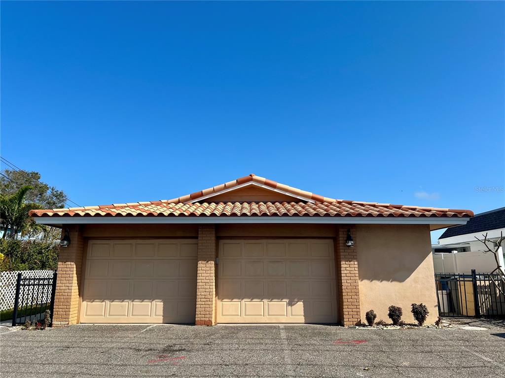 11315 3rd Street East Treasure Island, FL 33706 - Photo 2 of 46 a view of a house with a garage