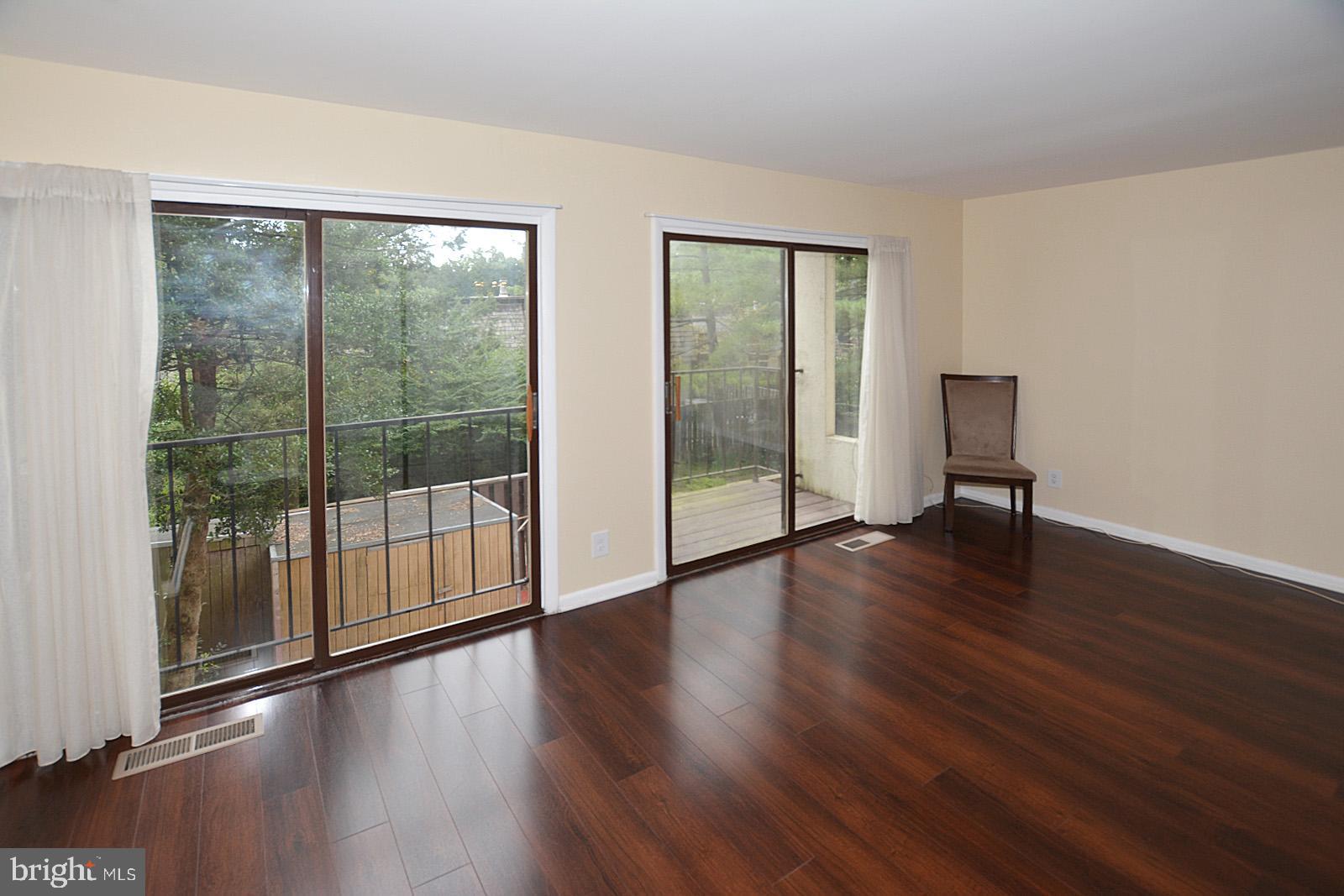 1639 Valencia Way Reston, VA 20190 - Photo 8 of 28 Living room with two balconies