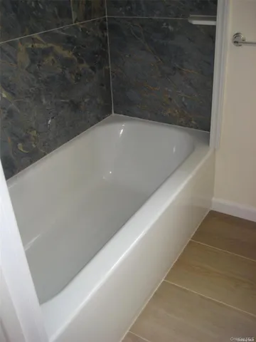 a view of a bathtub in bathroom
