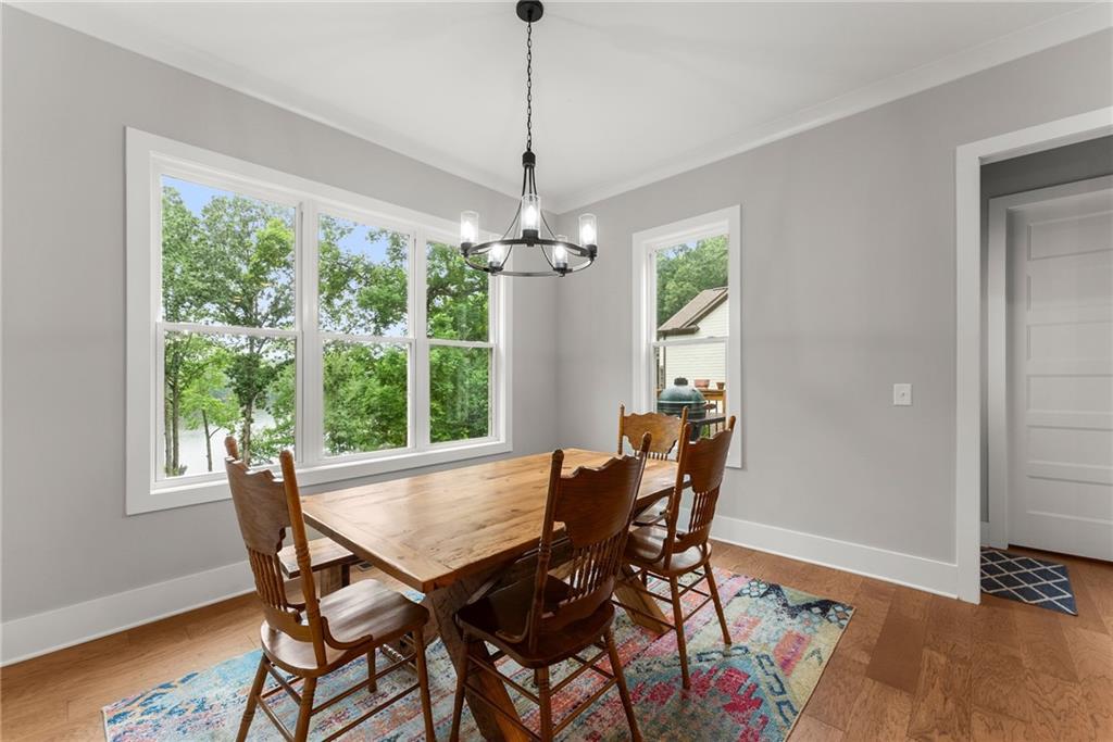 4847 Destitute Way Gainesville, GA 30506 - Photo 17 of 67 a view of a dining room with furniture window and wooden floor
