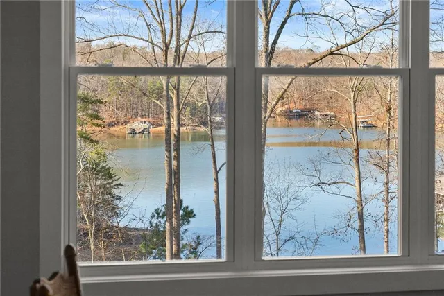 a bed room with a bed and a ceiling fan