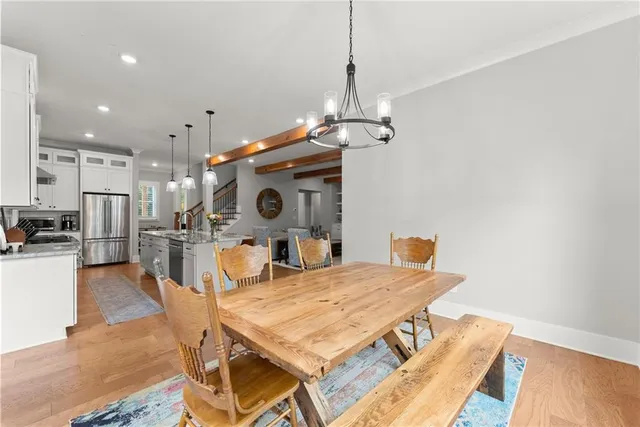 a living room with a large window and a flat screen tv