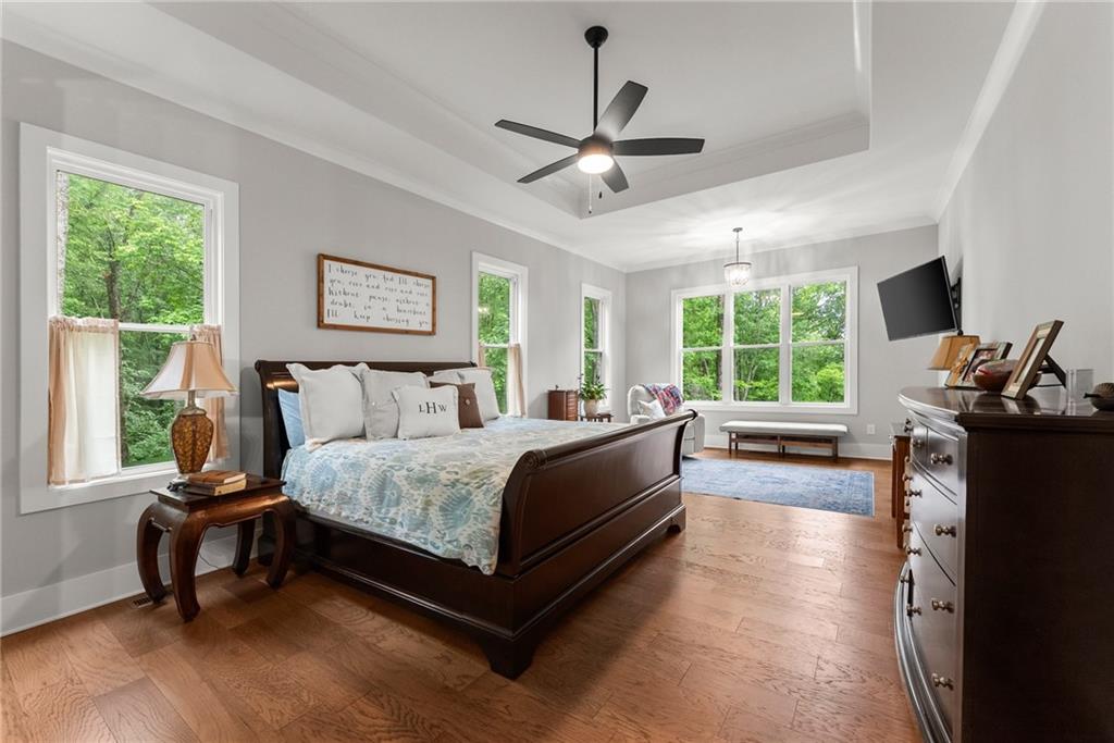 4847 Destitute Way Gainesville, GA 30506 - Photo 24 of 67 a spacious bedroom with a bed and a window
