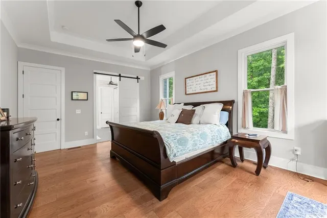 a bathroom with a granite countertop sink a toilet and a mirror