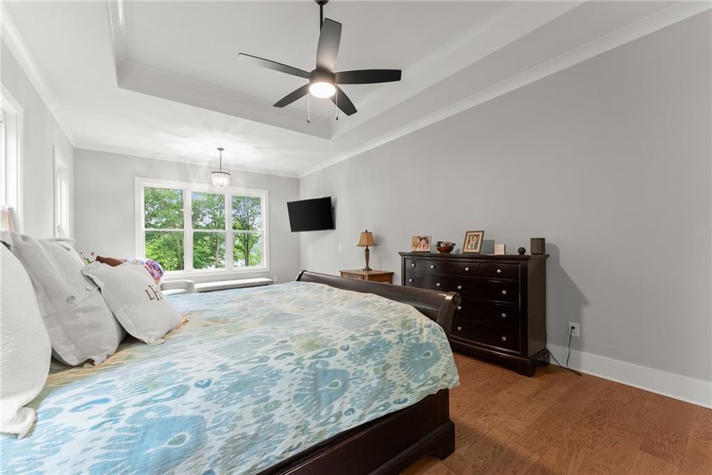 4847 Destitute Way Gainesville, GA 30506 - Photo 26 of 67 a bed room with a bed and a ceiling fan