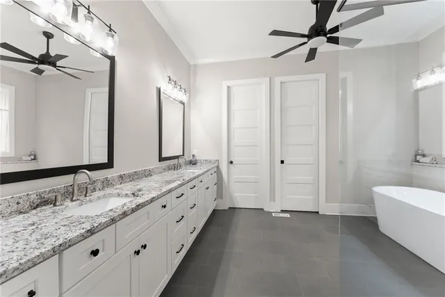 a living room with furniture and a lamp