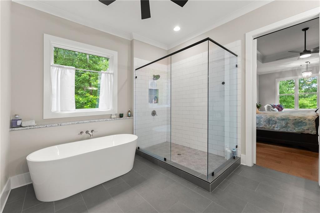 4847 Destitute Way Gainesville, GA 30506 - Photo 30 of 67 a spacious bathroom with a tub shower and window