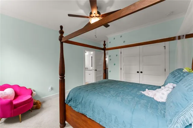 an aerial view of a house with a yard and lake view