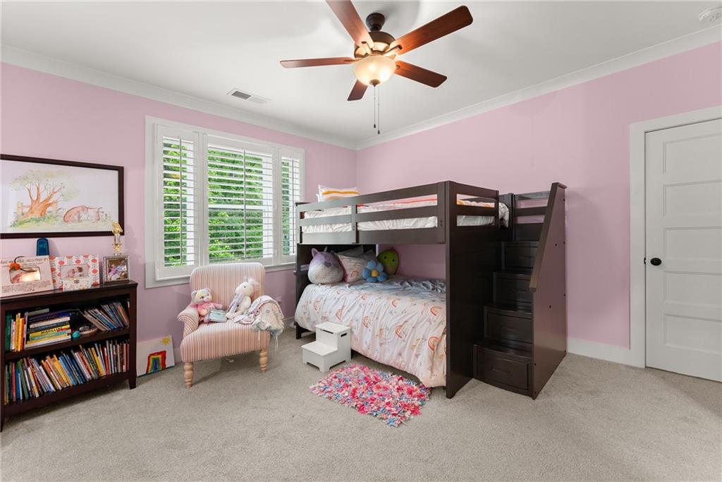 4847 Destitute Way Gainesville, GA 30506 - Photo 46 of 67 a bedroom with a bed and a book shelf
