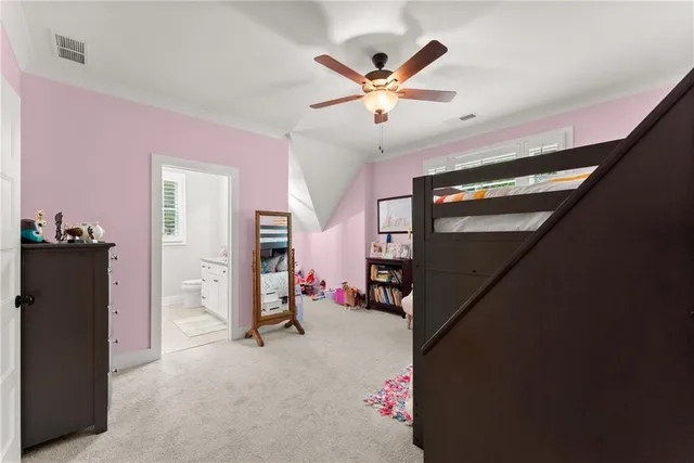 an aerial view of a house with a yard and trees all around