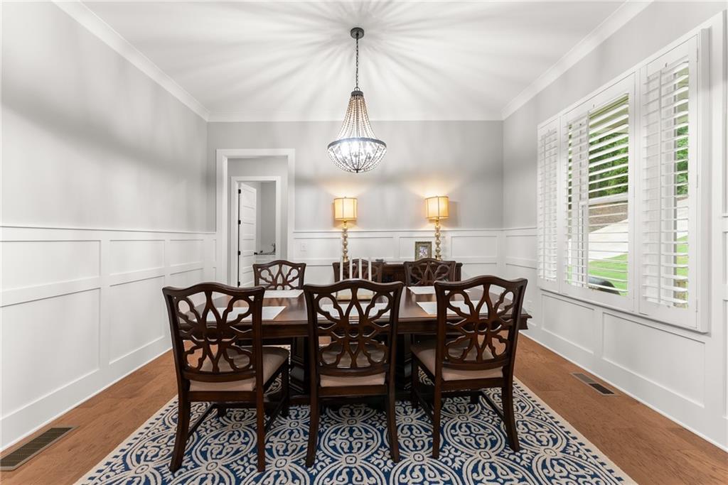 4847 Destitute Way Gainesville, GA 30506 - Photo 6 of 67 a view of a dining room with furniture window and wooden floor