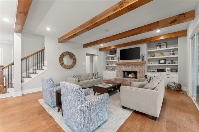a kitchen with granite countertop a sink a counter space appliances and cabinets