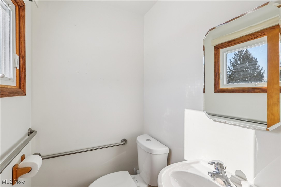 970 Eastern Road Doylestown, OH 44230 - Photo 20 of 49 Half bathroom with toilet and a sink
