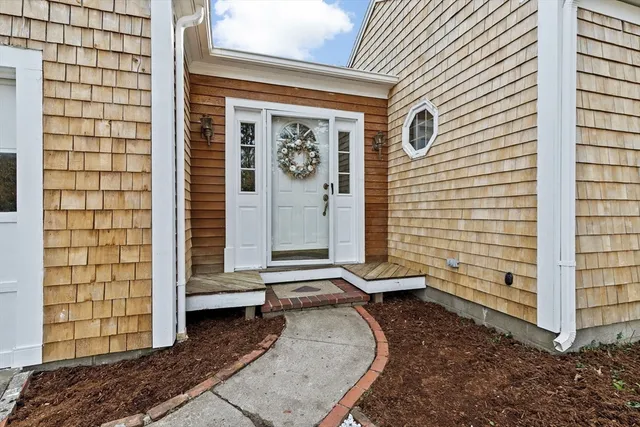 a view of a door of a house with a door and wooden floor