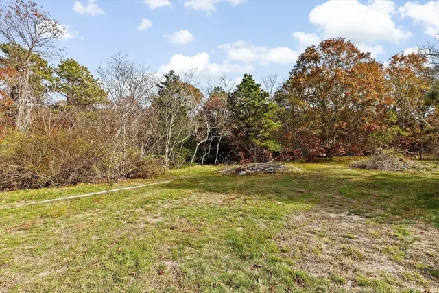 a view of a swimming pool with an outdoor space and seating area