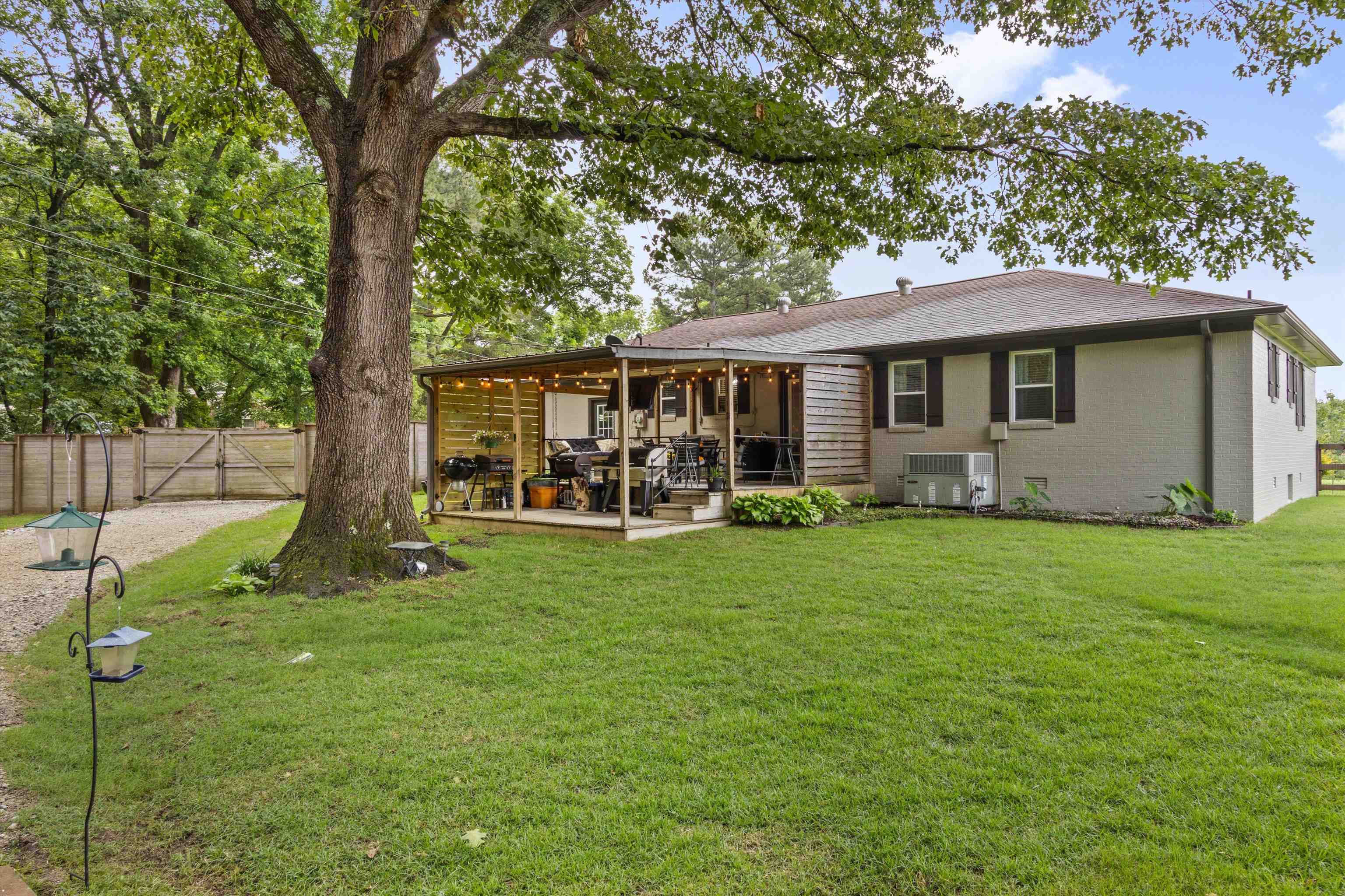 4500 Drummonds Road Drummonds, TN 38023 - Photo 26 of 29 a view of a house with a backyard and a patio