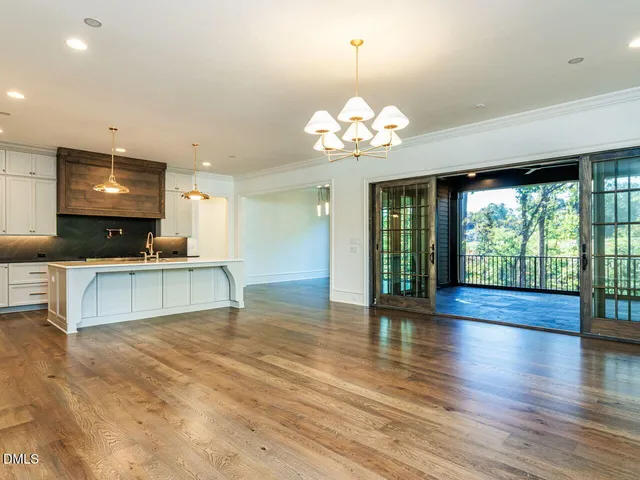 a kitchen with kitchen island a sink stainless steel appliances and cabinets