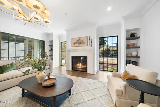 a spacious bathroom with a double vanity sink a mirror and a bathtub