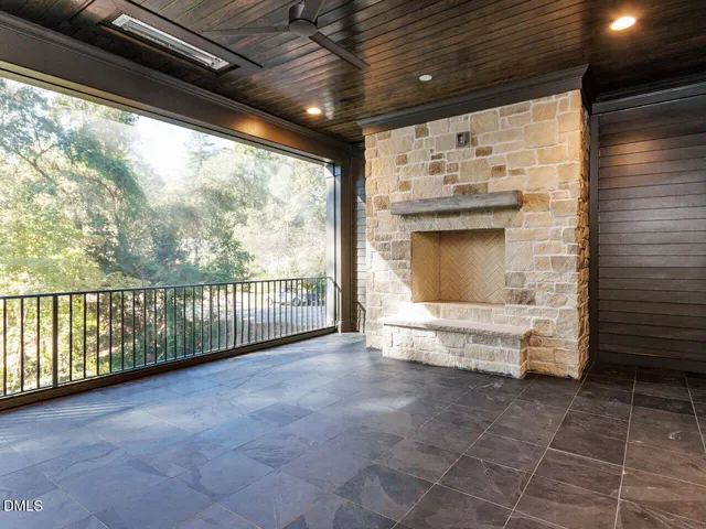 a kitchen with a sink cabinets and wooden floor