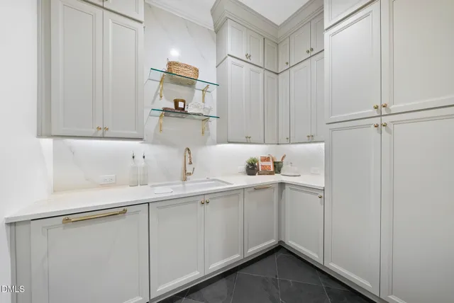 a view of a bathroom with a shower and a sink