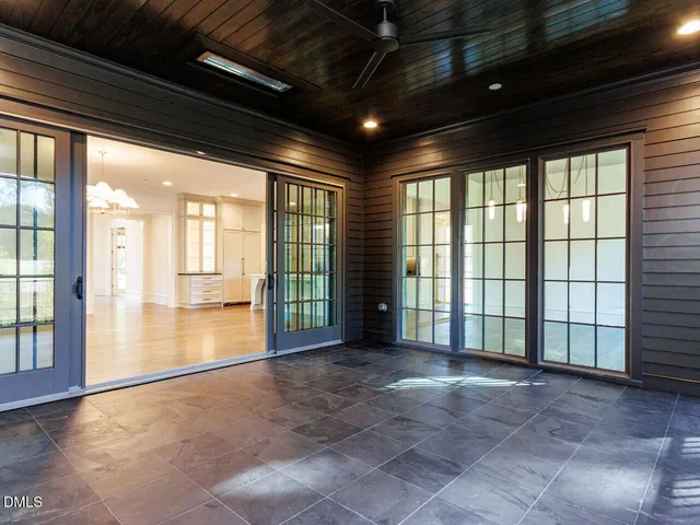 a kitchen with kitchen island a counter space a sink a stove and a refrigerator
