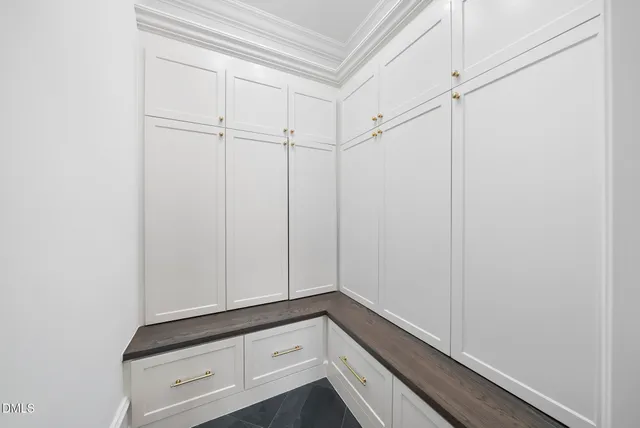 a kitchen with a refrigerator and sink