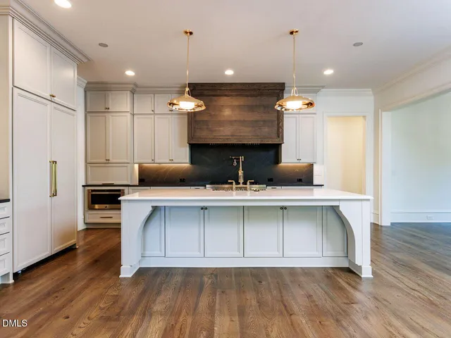 a stove top oven sitting inside of a kitchen