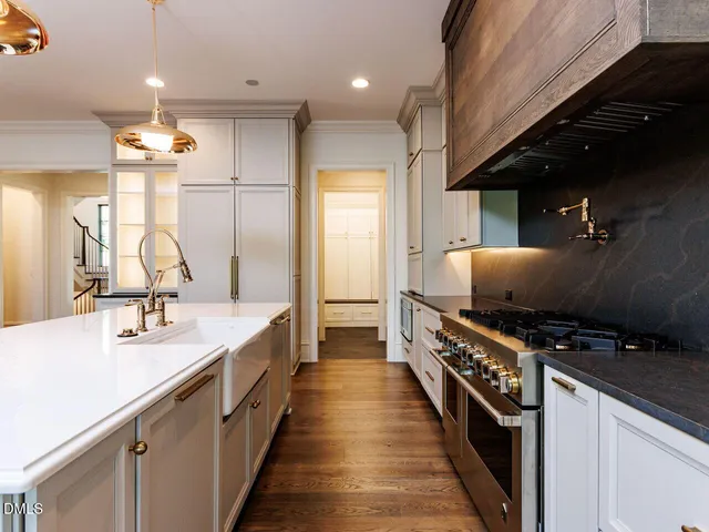 a view of an room with wooden floor and windows