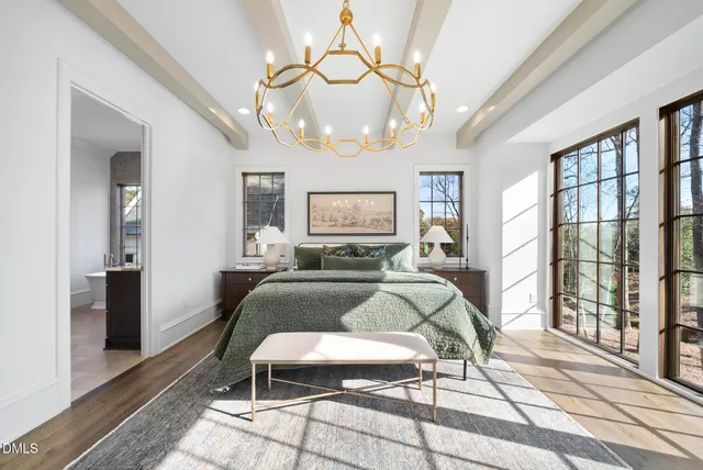 a view of a dining room with furniture and a potted plant