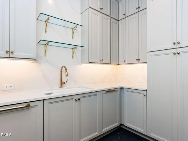 a view of living room kitchen with a large window