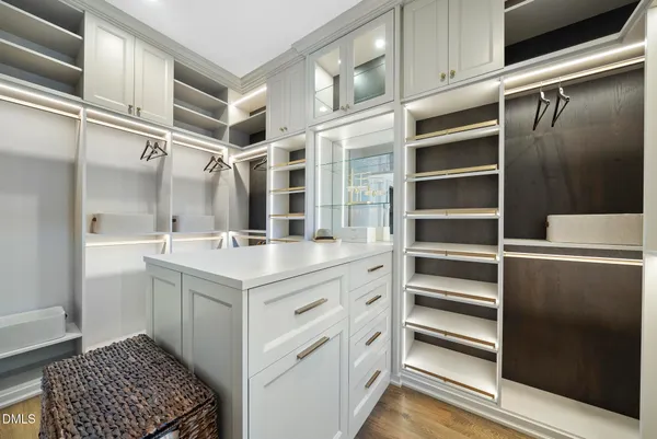 a view of a dining room with furniture and a potted plant