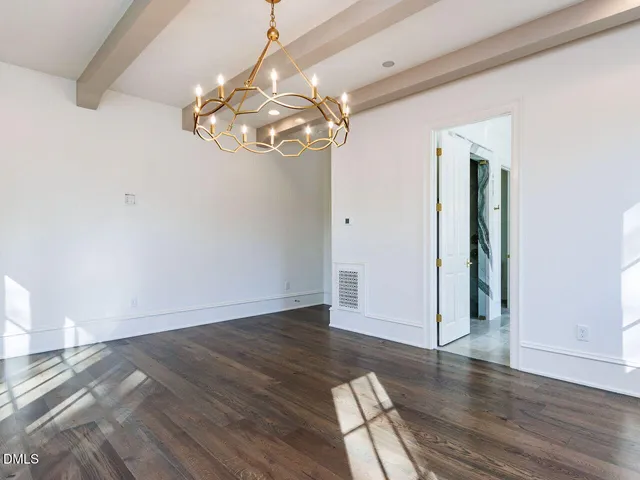 a kitchen with stainless steel appliances cabinets and a large window