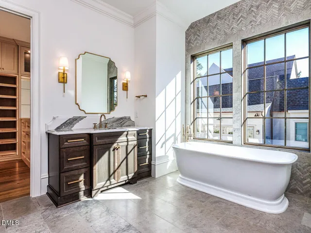 a close view of a sink and cabinets in a room