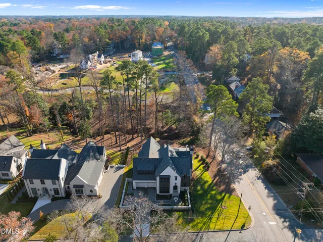 a kitchen with a dining table chairs sink and cabinets