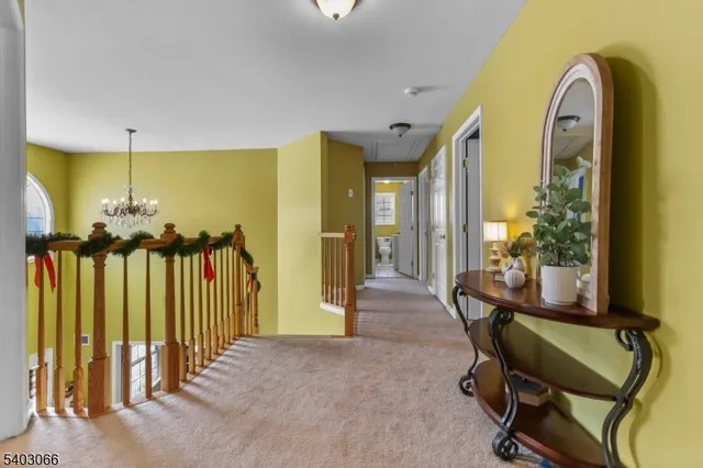 a view of a livingroom with furniture and staircase
