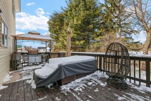 a view of a patio with iron fence