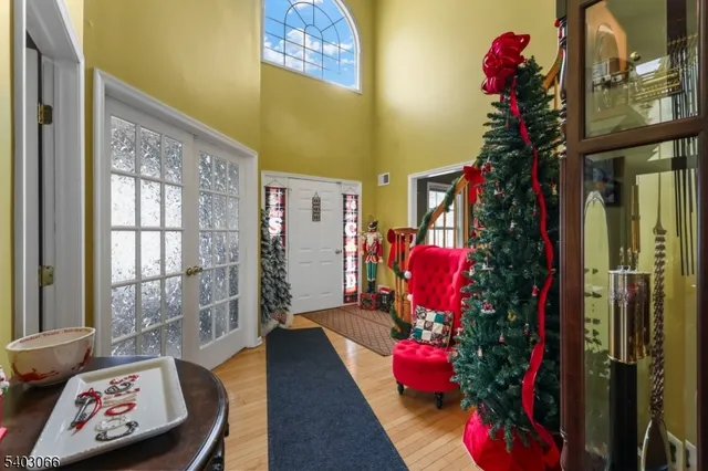 a view of living room filled with furniture and wooden floor