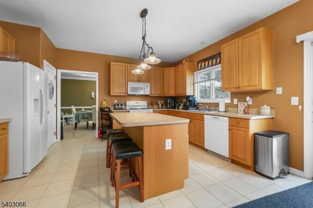 a kitchen that has a lot of cabinets in it and appliances