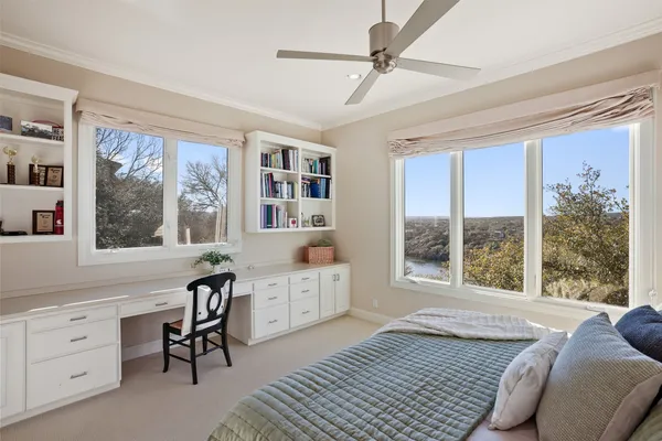 a bedroom with furniture and windows